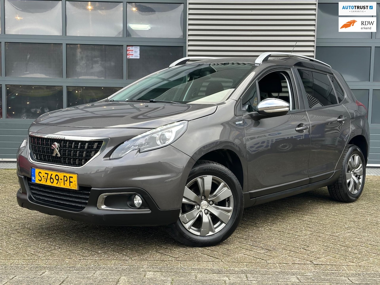 Peugeot 2008 - 1.2 PureTech Allure | Navi | CRUISECR | PDC - AutoWereld.nl