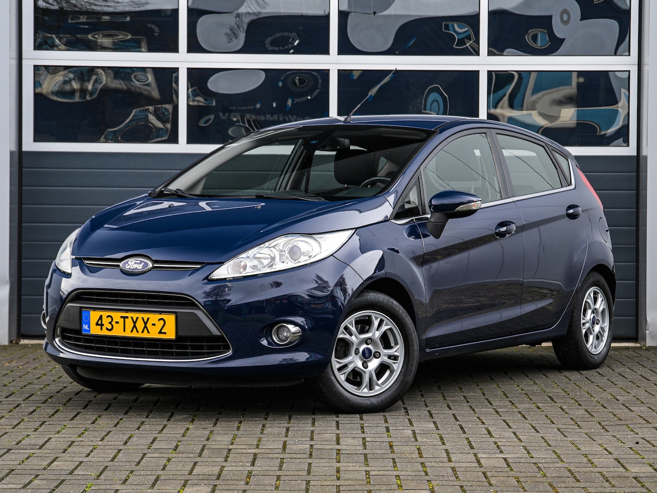 Ford Fiesta - 1.6 TDCi Lease Titanium | Climate control | Cruise control | PDC | Trekhaak - AutoWereld.nl