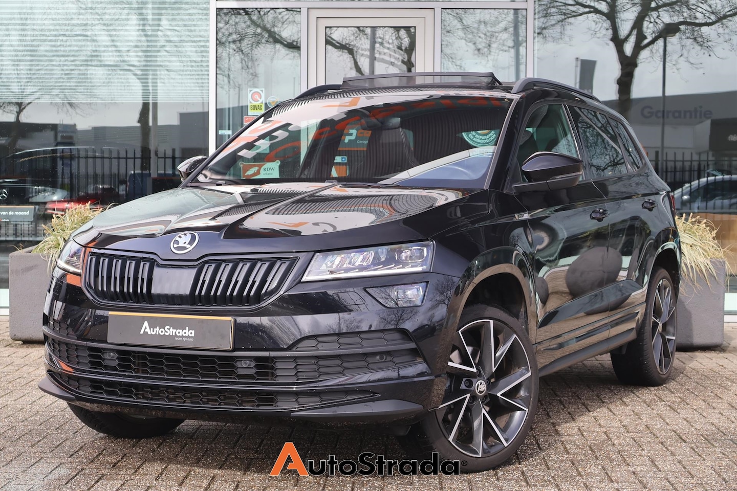 Skoda Karoq - 1.5 SportLine TSI ACT 150pk | Sfeer | Cruise | Climate | Camera | Stoelverwarming | Trekha - AutoWereld.nl