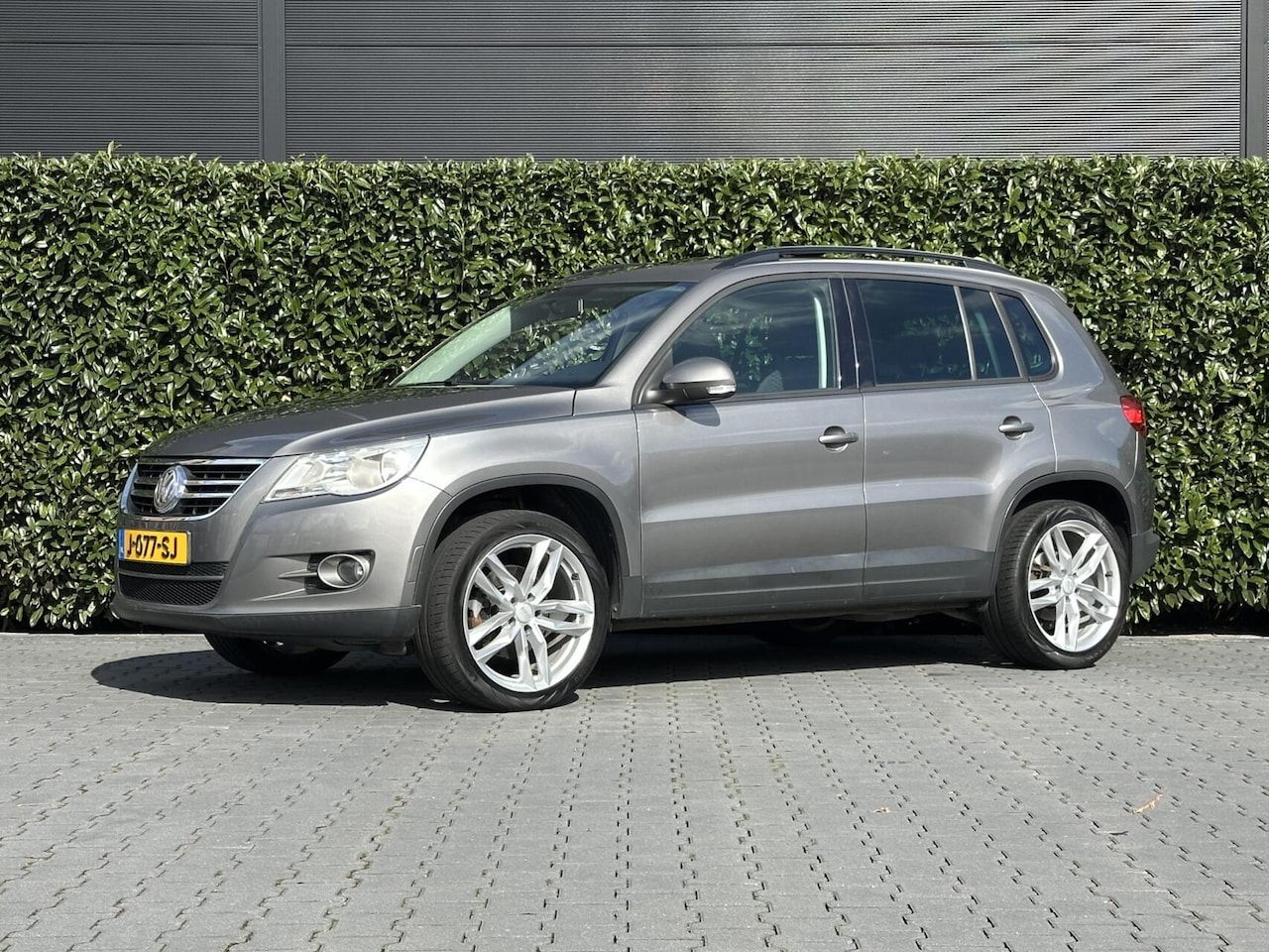 Volkswagen Tiguan - 2.0 TSI Sport&Style 4Motion, PANORAMADAK, CRUISE CONTROL, AIRCO, STOELVERWARMING, TREKHAAK - AutoWereld.nl