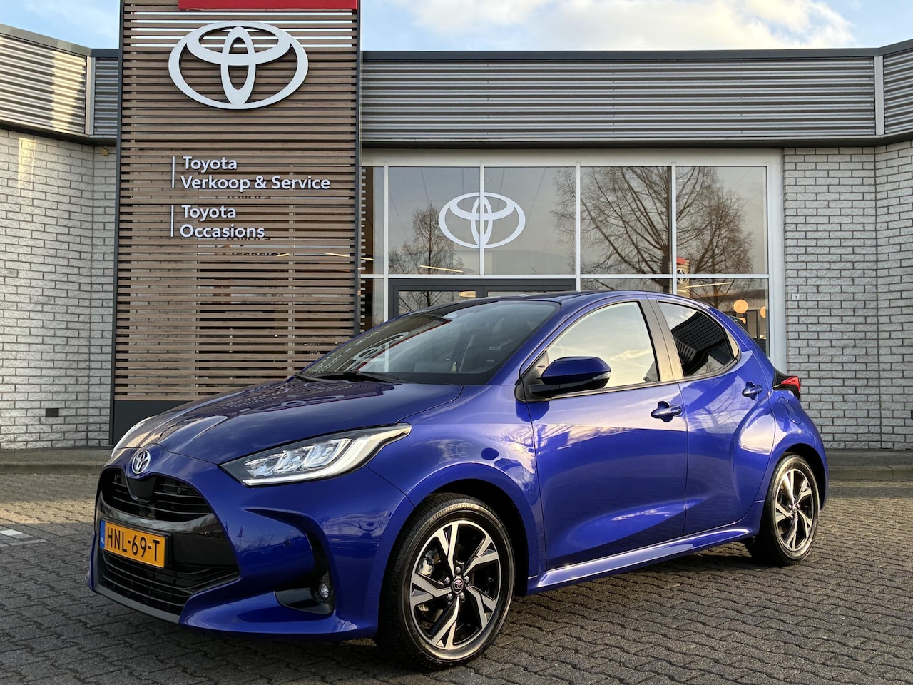 Toyota Yaris - HYBRID 115 DYNAMIC COMFORT-PACK STOEL/STUURVERW PARK-SENSOREN BLIND-SPOT CLIMA AD-CRUISE N - AutoWereld.nl