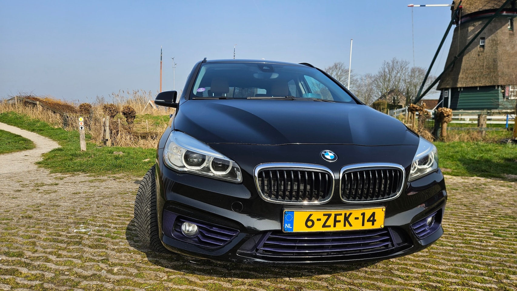 BMW 2-serie Active Tourer - 218i High Executive trekhaak, lederen bekleding, headup display, climate control, goede all season banden, ver - AutoWereld.nl