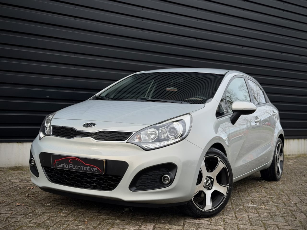 Kia Rio - 1.2 CVVT Super Pack CLIMA|CRUISE|KEYLESS|PDC|LED - AutoWereld.nl