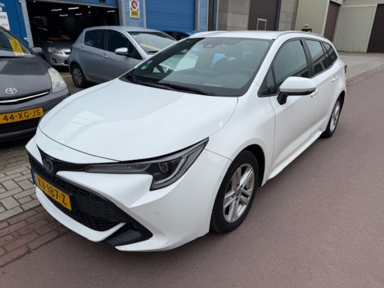 Toyota Corolla Touring Sports - 1.8 Hybrid Business Intro 2019 BTW car NAP 100% Toyota dealer onderhouden van de 1e eigena - AutoWereld.nl