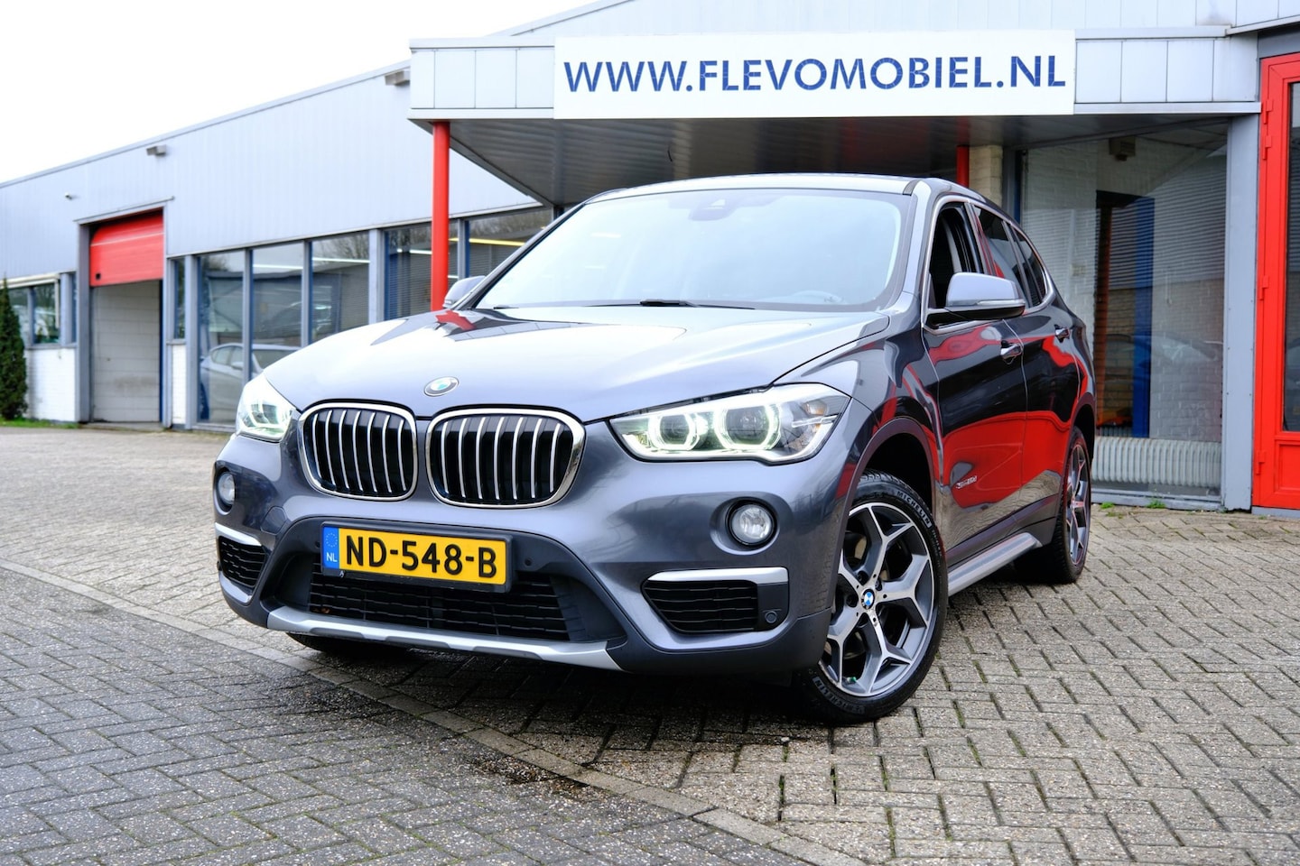 BMW X1 - SDrive20d Centennial High Executive Aut. Navi|Leder|HUD|Sportstoelen|LMV - AutoWereld.nl
