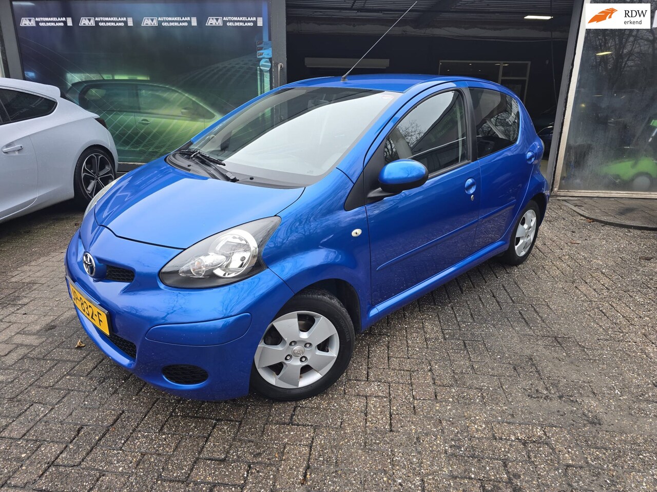 Toyota Aygo - 1.0-12V Dynamic Blue | NW KOPPELING | 12MND GARANTIE | AUTOMAAT | AIRCO | ELEC RAMEN | LMV - AutoWereld.nl