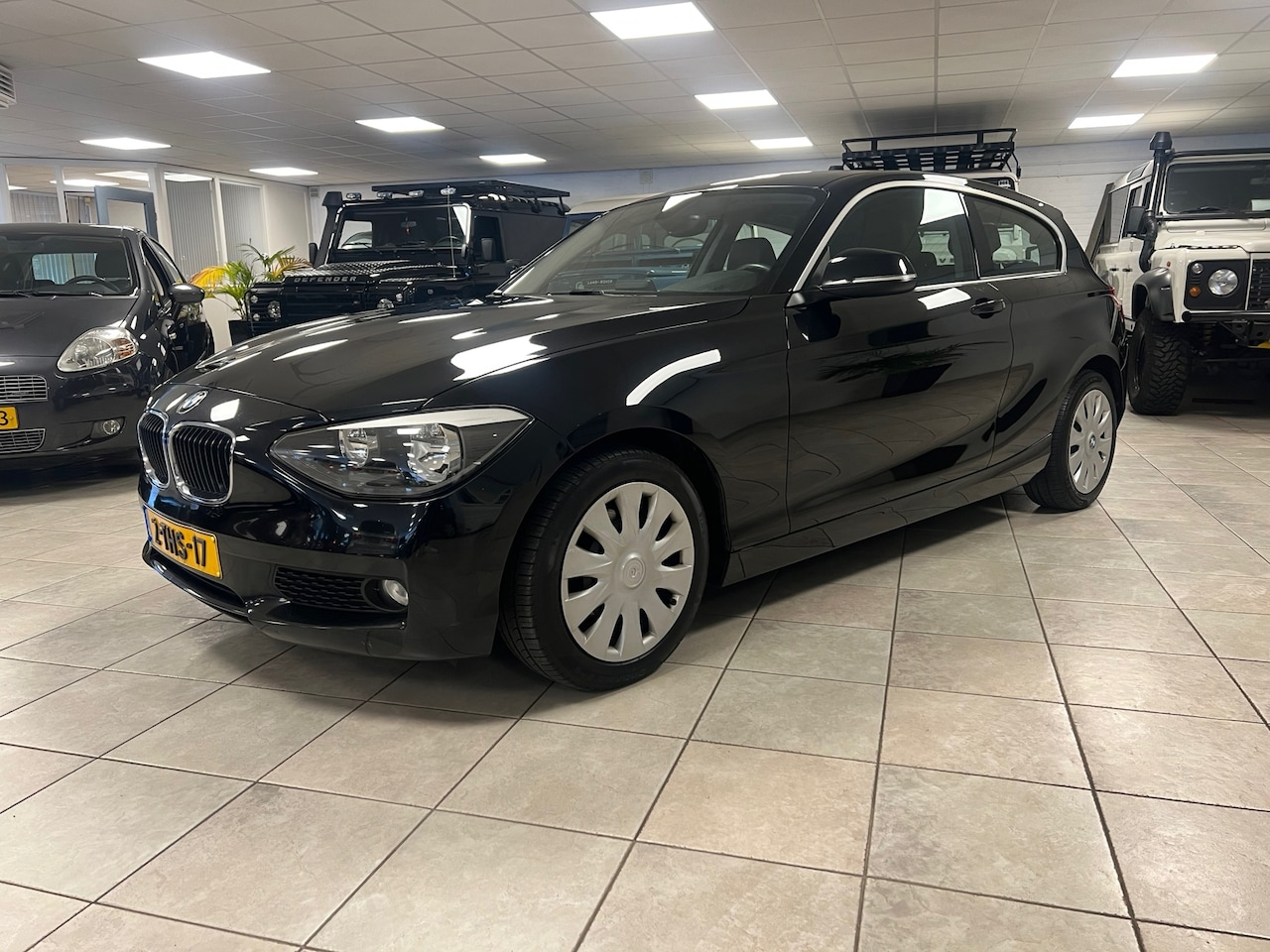 BMW 1-serie - 116i Business Lederen bekleding, Airco, Cruise controle, Parkeersensoren. - AutoWereld.nl