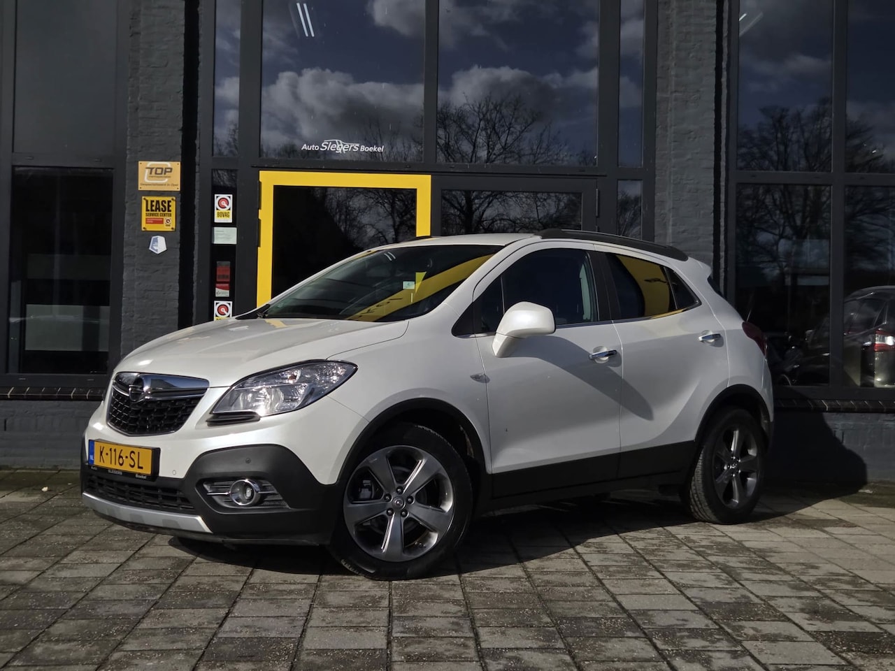 Opel Mokka - 1.6 Cosmo | Trekhaak | Parkeersensoren V+Ar | Climate Control | Cruise Control | Navi | St - AutoWereld.nl