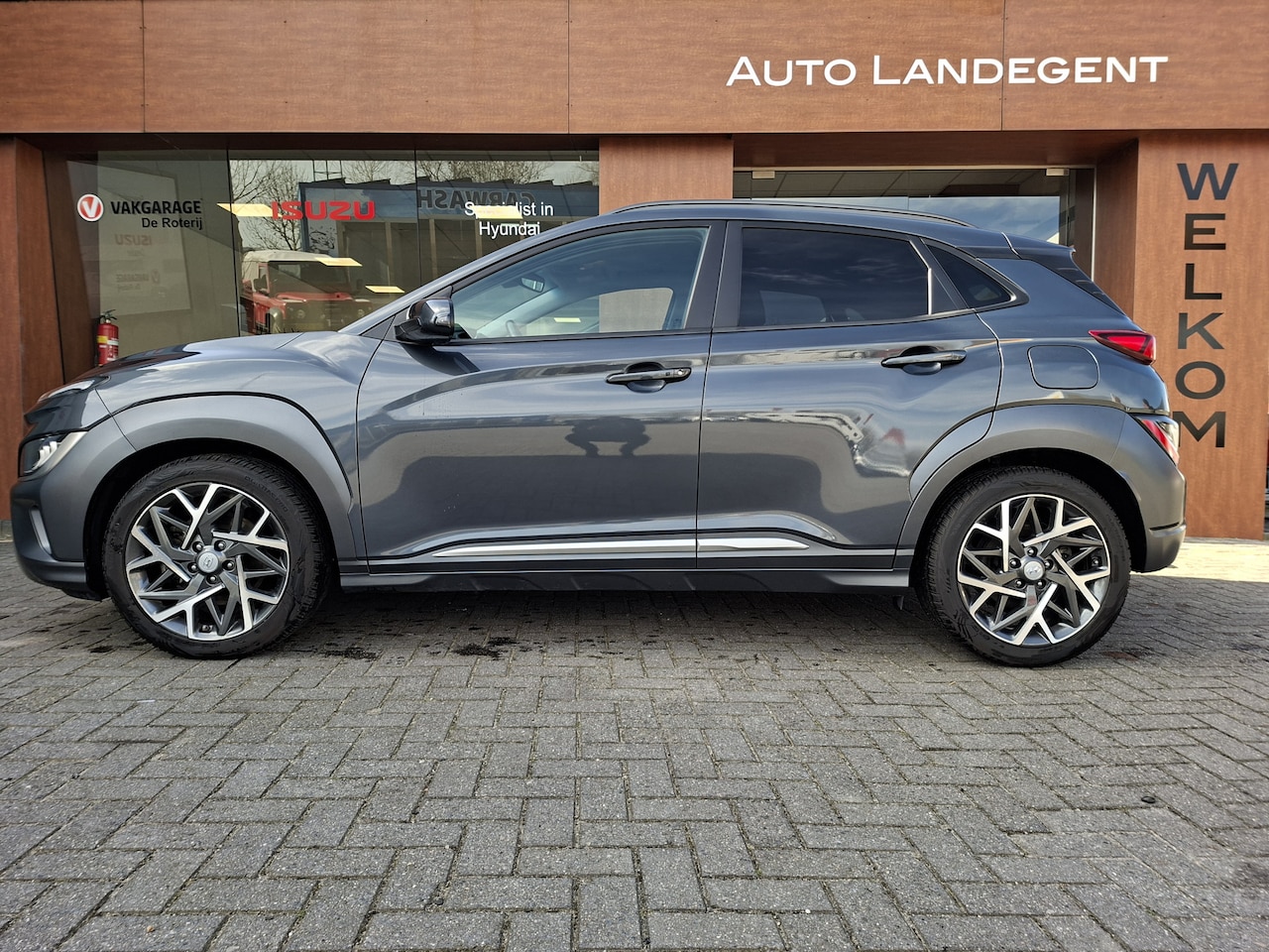 Hyundai Kona - 1.6 GDI HEV Premium | Lederen bekleding | Stoel/stuur verwarming en koeling | Trekhaak - AutoWereld.nl