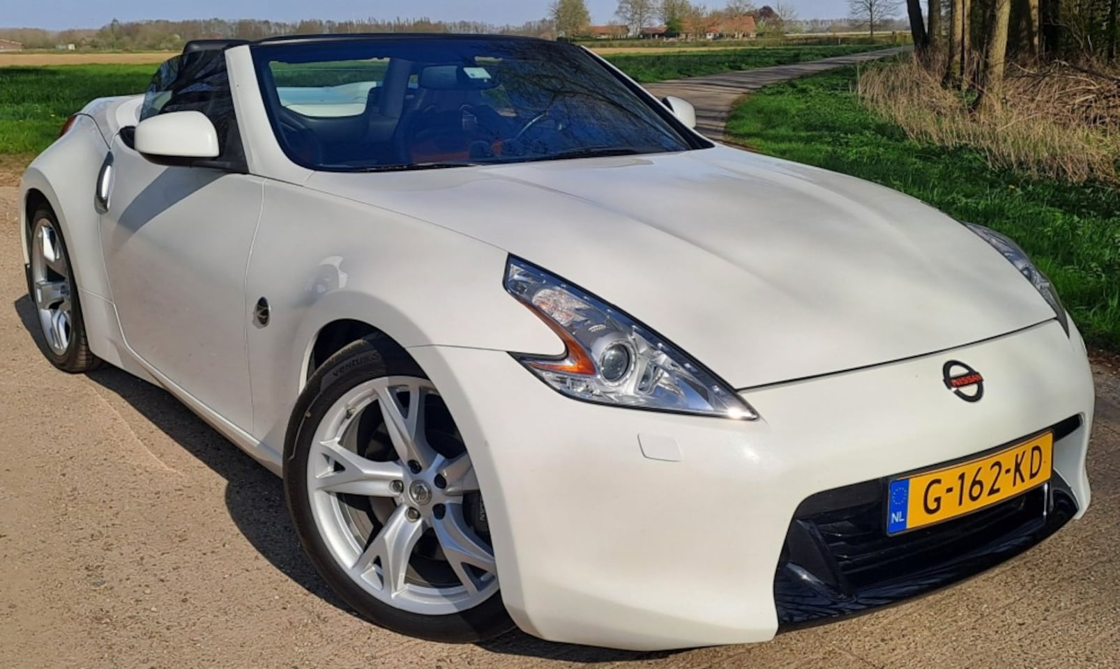 Nissan 370Z - 3.7 V6/338pk/AUT/7 Traps/Xenon/Navi/Recaro/Nismo/Top - AutoWereld.nl