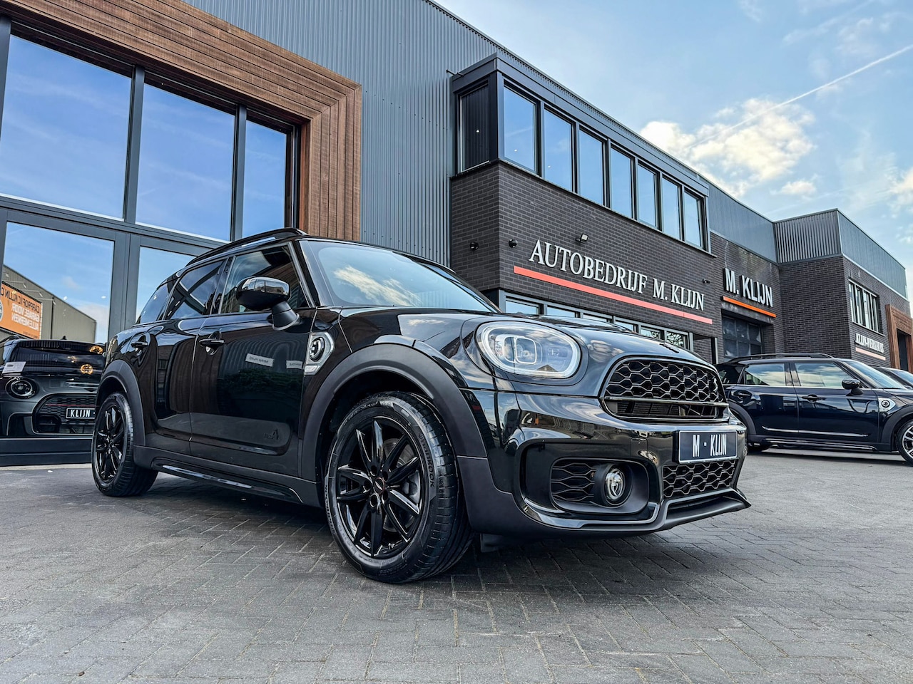 MINI Countryman - Mini Cooper S E ALL4 John Cooper Works 220pk Blackline/Camera/Navi/Jcw stoelen/Btw - AutoWereld.nl