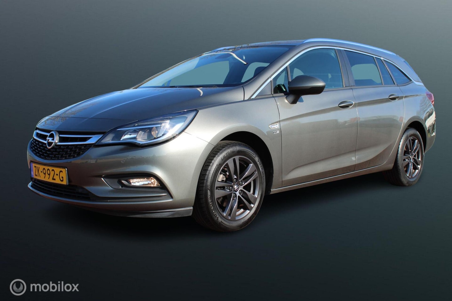 Opel Astra Sports Tourer - 1.0 Turbo 120 Jaar Edition 1.0 Turbo 120 Jaar Edition, Navigatie, Pdc voor + achter. Cruise, App connect, Donker glas - AutoWereld.nl