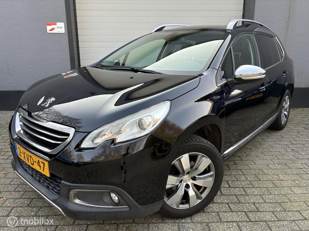 Peugeot 2008 - 1.2 PureTech Allure / airco / cruise / pano / - AutoWereld.nl