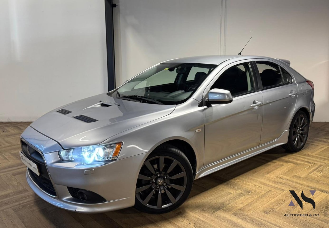 Mitsubishi Lancer Sports Sedan - 2.0 Evolution GSR KEYLESS NAVI - AutoWereld.nl