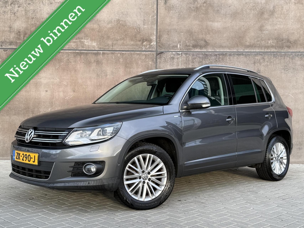 Volkswagen Tiguan - 1.4 TSI Sport&Style Trekhaak | navigatie | Climate control | Xenon | Cruise Control | - AutoWereld.nl