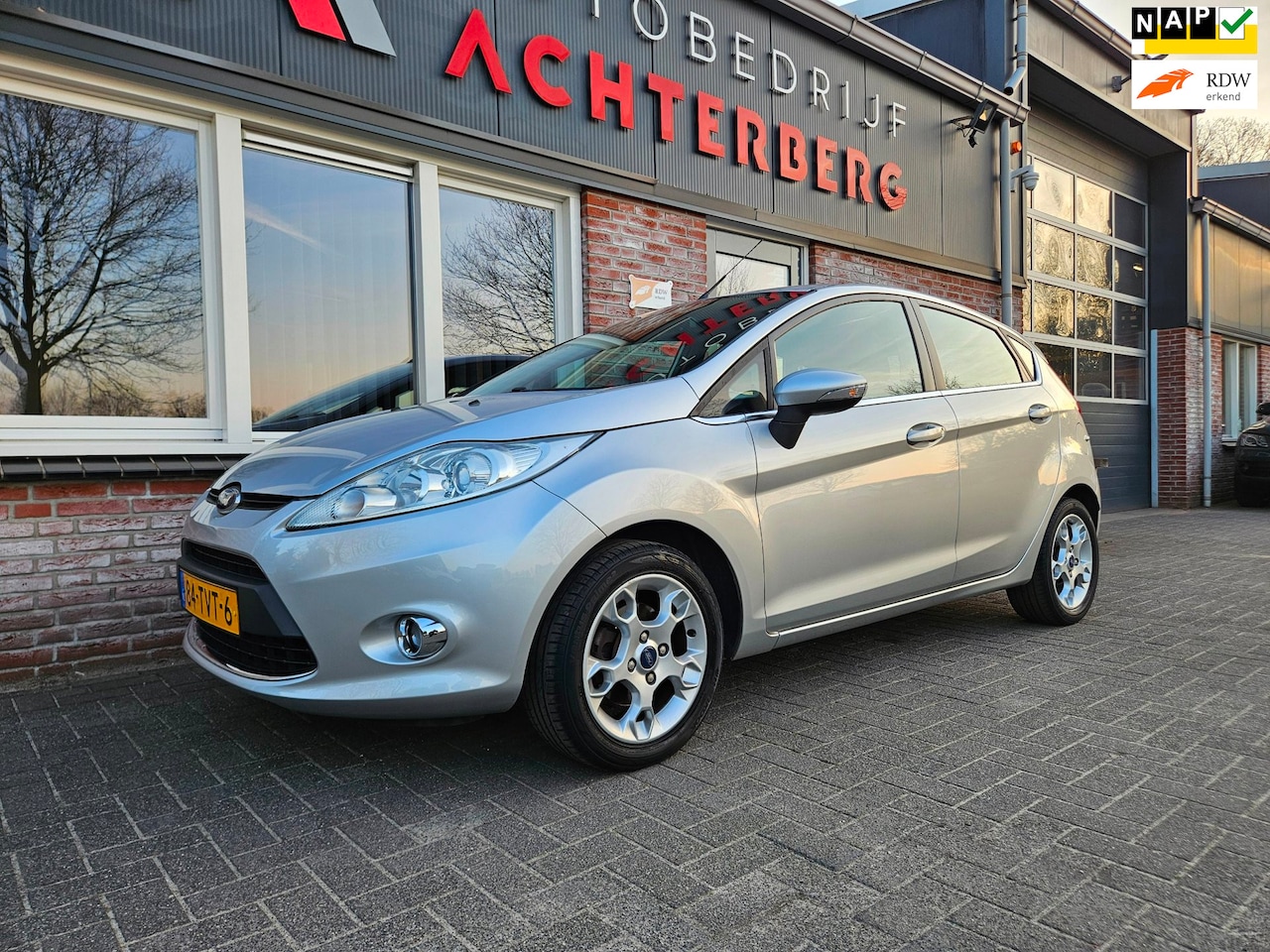 Ford Fiesta - 1.25 Titanium Trekhaak! Airco/Clima! Xenon! Cruise Control! Nette Auto! 5-Deurs! NAP! - AutoWereld.nl