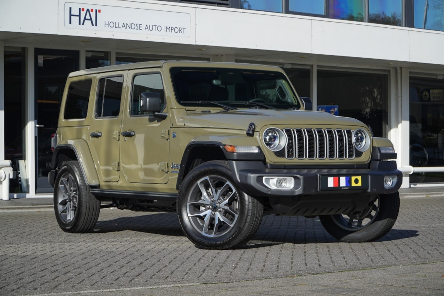 Jeep Wrangler Unlimited - 4xe 380 Sahara I Nw. Model I 20 inch I Elektrische stoelen I 4 J - AutoWereld.nl