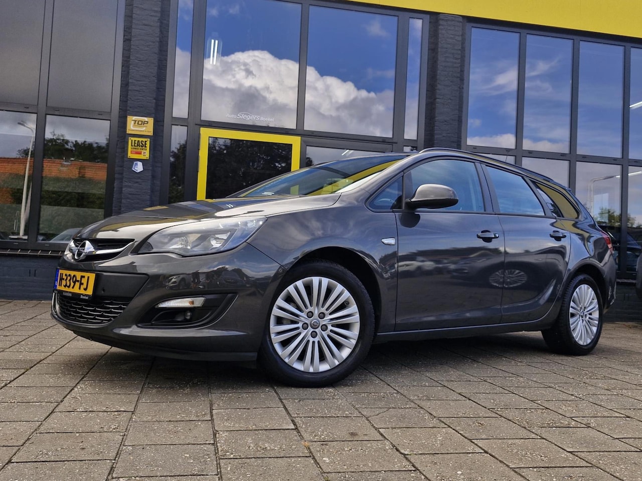 Opel Astra Sports Tourer - 1.4 Turbo Business + | Trekhaak | Parkeer Sensoren V + A | Cruise Control | Climate Contro - AutoWereld.nl