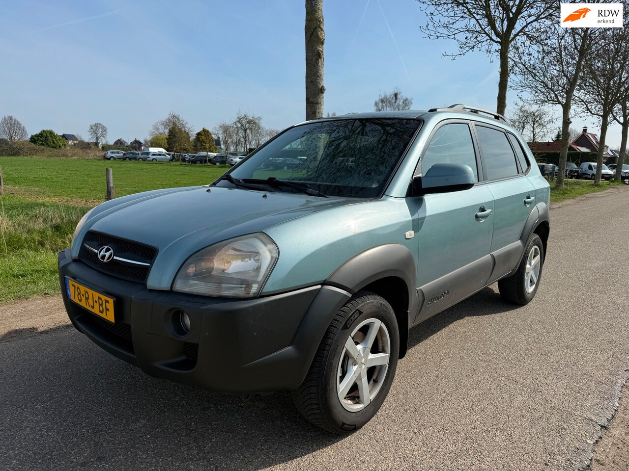 Hyundai Tucson - 2.0i Dynamic Airco/Trekhaak - AutoWereld.nl