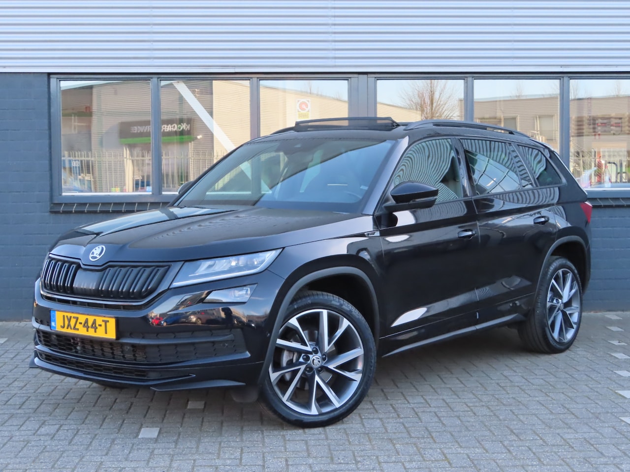 Skoda Kodiaq - 1.5 TSI Sportline Business 7p. DSG | pano dak | adaptive cruise | elektrische achterklep - AutoWereld.nl