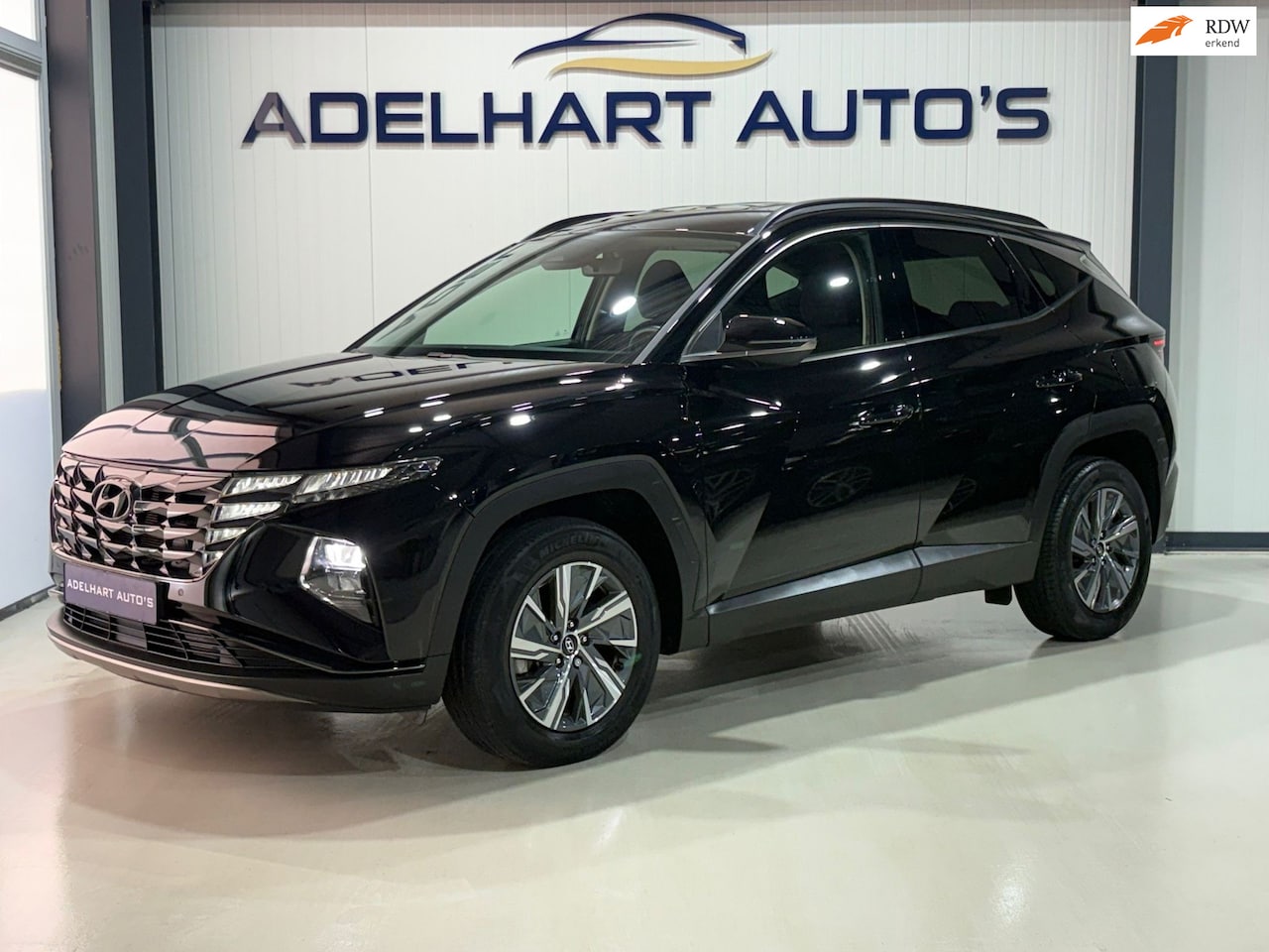 Hyundai Tucson - 1.6 T-GDI HEV Comfort 230 PK Automaat / Navigatie full map / Camera / Cruise control etc.. - AutoWereld.nl