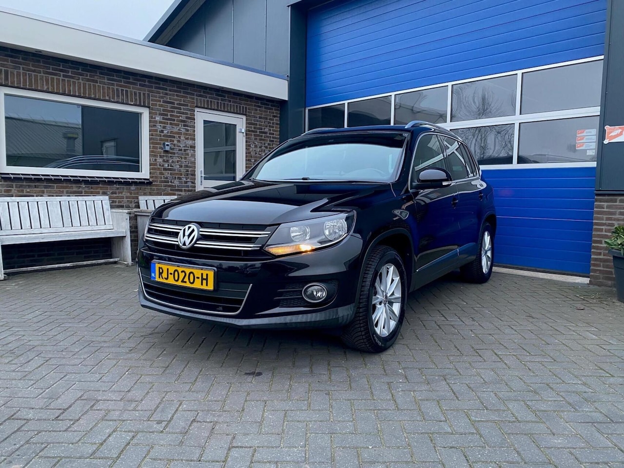 Volkswagen Tiguan - 1.4 TSI Sport&Style Cruise Clima trekhaak - AutoWereld.nl