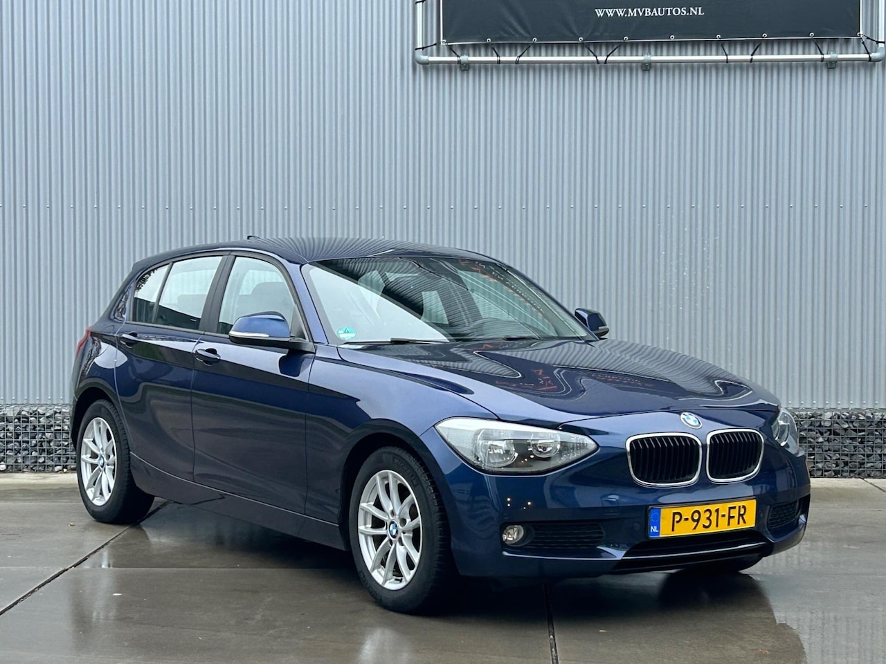 BMW 1-serie - 116i High Executive 116i High Executive, navi, stoelverwarming, cruise - AutoWereld.nl