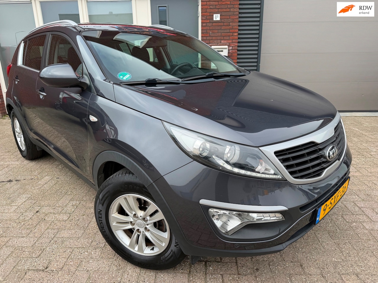 Kia Sportage - 1.6 GDI Vibe / Navi / Camera / PDC / Clima / Cruise - AutoWereld.nl