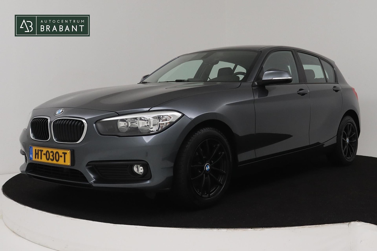 BMW 1-serie - 118i EDE Automaat Essential Sport (NAVIGATIE, LEDER, CLIMA, PDC) - AutoWereld.nl