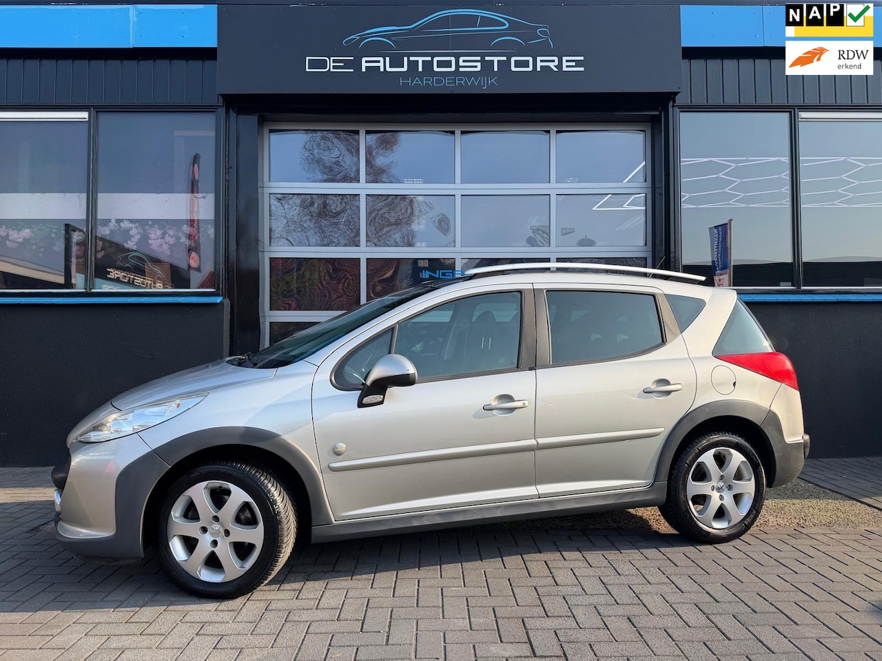 Peugeot 207 SW Outdoor - 1.6 VTi XS Airco Half leder Panodak Trekhaak bak ligt hoorbaar!! - AutoWereld.nl