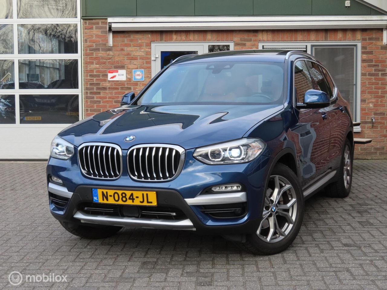 BMW X3 - xDrive20i High Executive|Leder|Pano|Wegklapbare trekhaak|HUD|Camera|Zwarte Hemel. - AutoWereld.nl