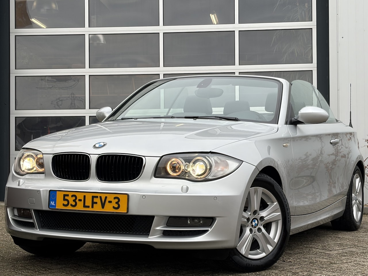 BMW 1-serie Cabrio - 118i High Executive 143pk | Airco automatisch | Cruise control | Lederen bekleding | Navig - AutoWereld.nl