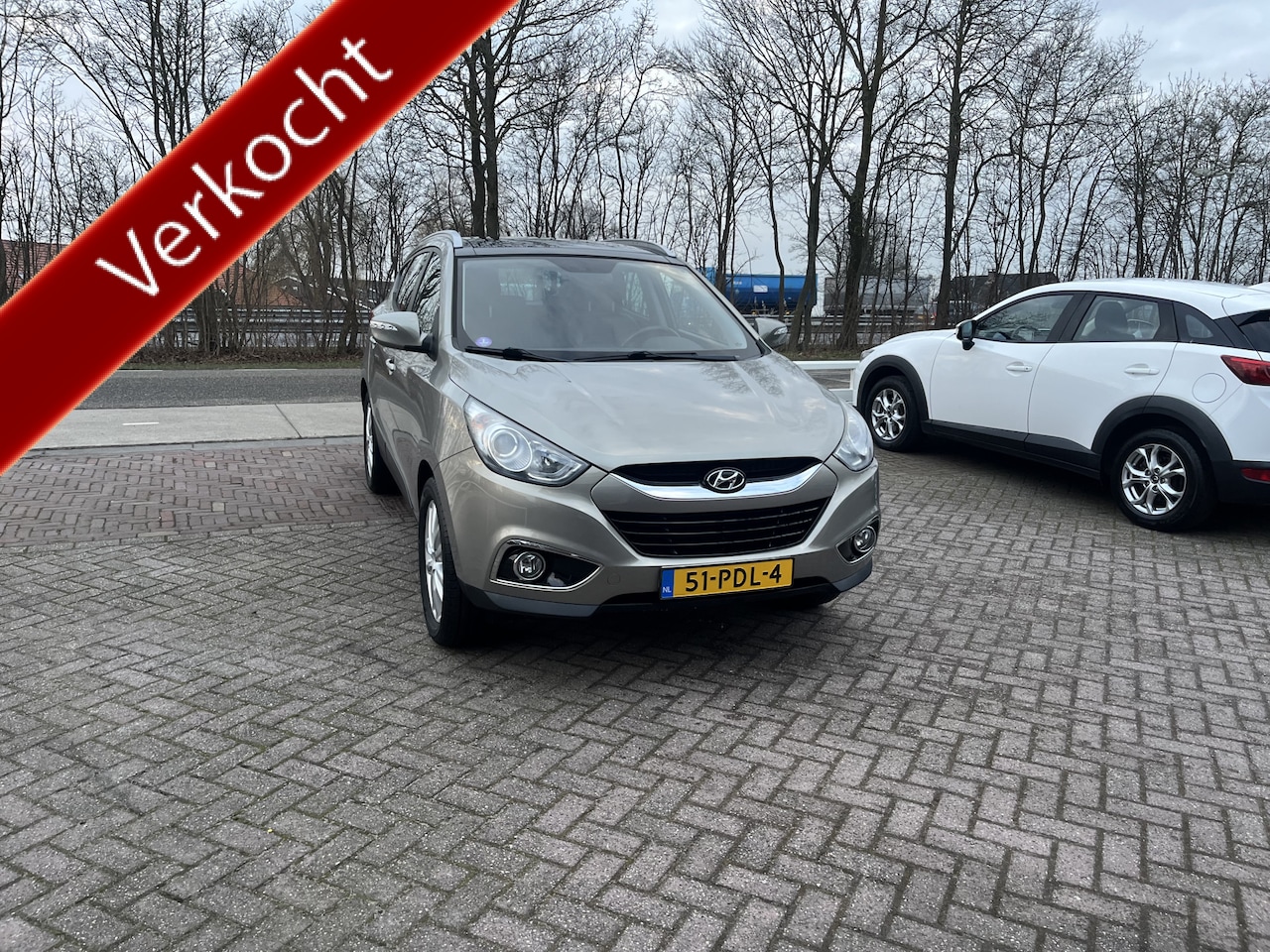 Hyundai ix35 - 2.0i i-Catcher OPEN DAK STOELVERWARMING V+A LEER CAMERA NAVI - AutoWereld.nl
