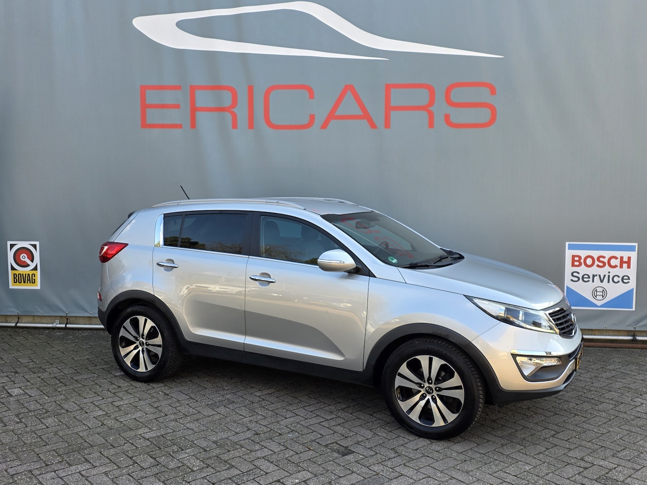 Kia Sportage - 1.6 GDI X-ecutive Plus Pack PDC ECC CC LEER - AutoWereld.nl