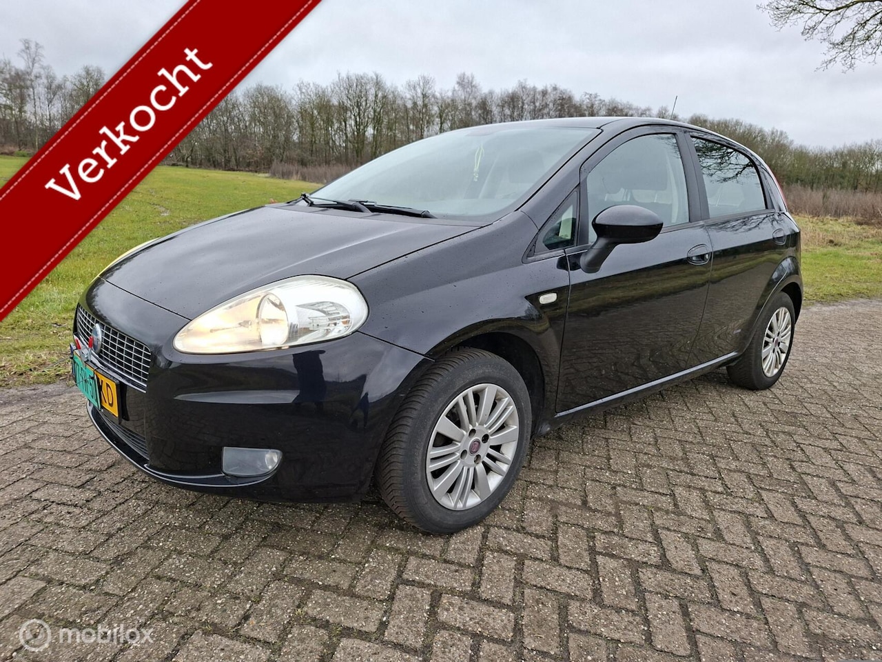 Fiat Grande Punto - 1.4 Edizione Lusso 4 dr goed onderhouden - AutoWereld.nl
