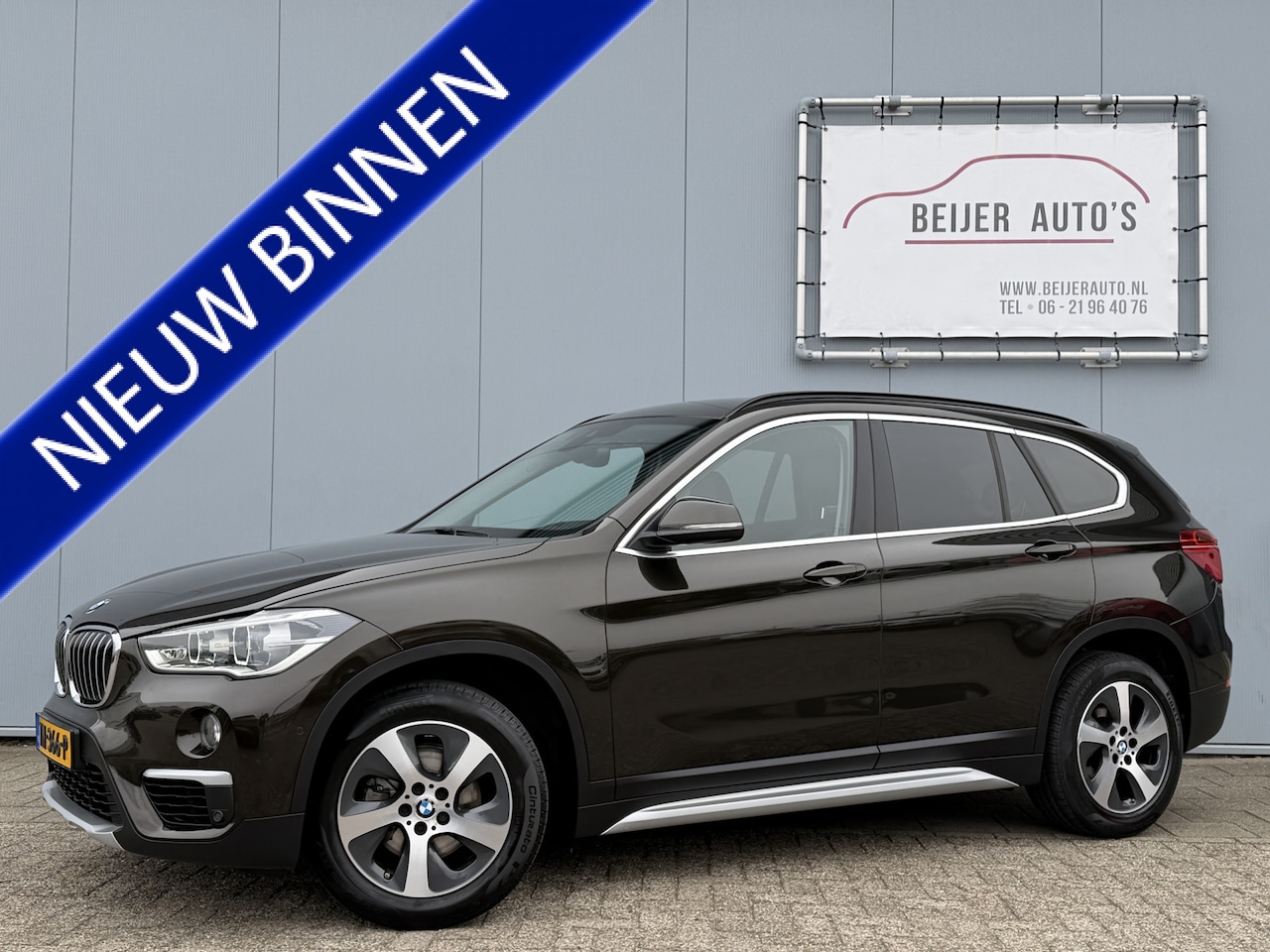 BMW X1 - sDrive18i High Executive Automaat Navigatie/Trekhaak/LED. - AutoWereld.nl