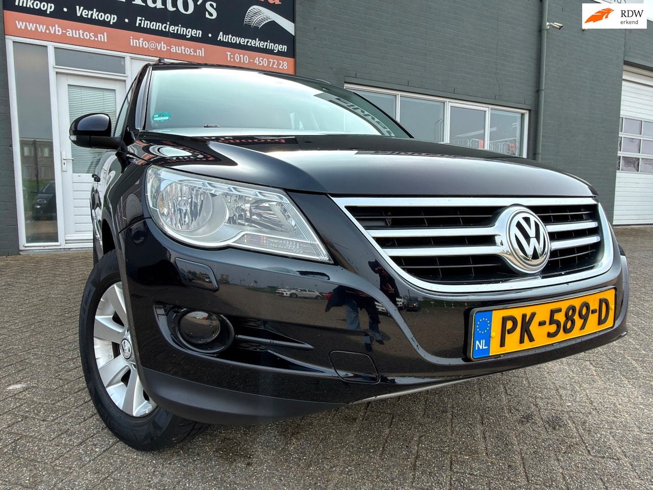 Volkswagen Tiguan - 1.4 TSI Track&Field 4Motion 6 bak met elec. panoramadak en navigatie en parkeersensoren en - AutoWereld.nl
