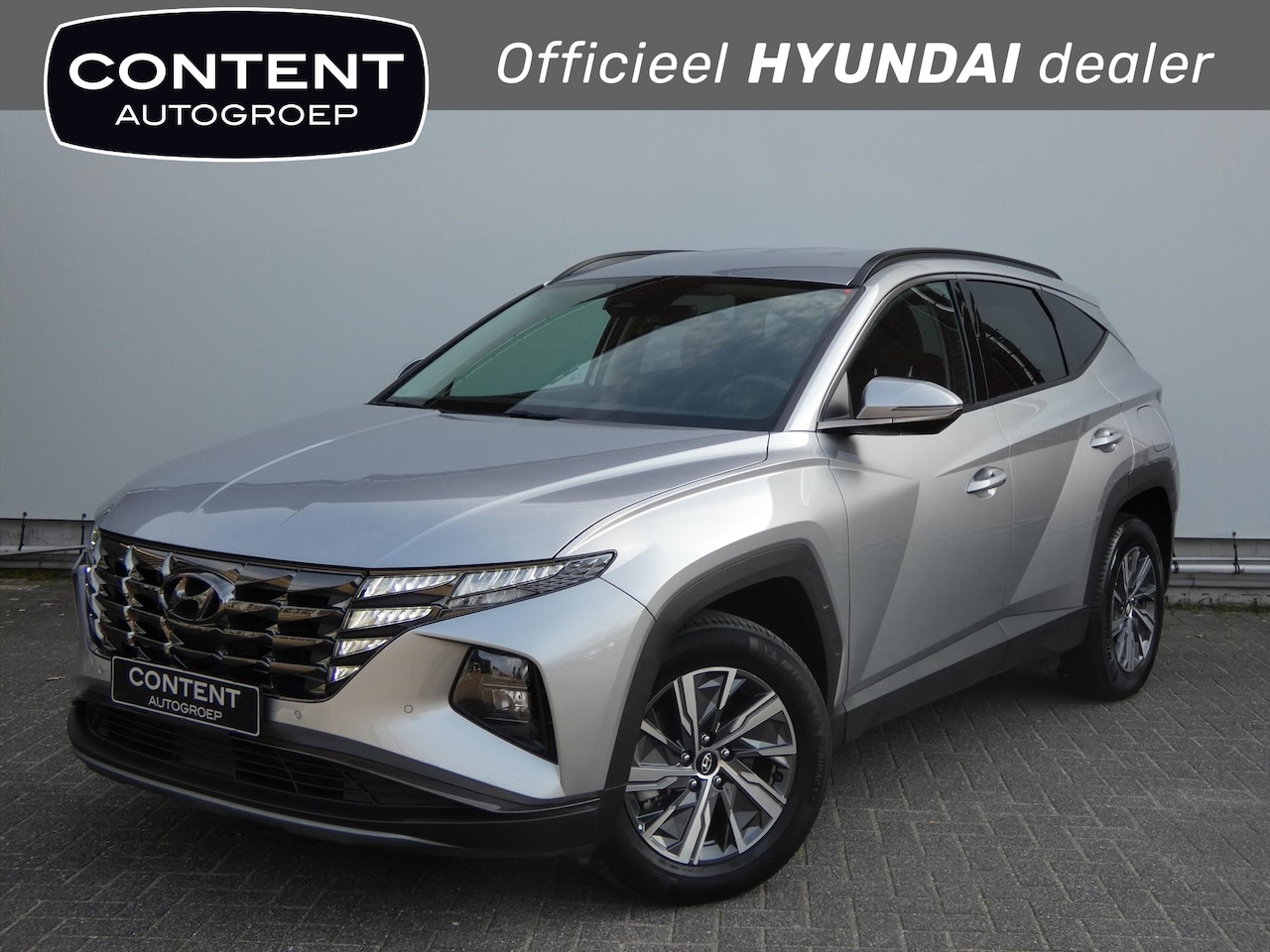 Hyundai Tucson - 1.6 HEV Aut. Comfort |Navi |Cruise |Airco - AutoWereld.nl