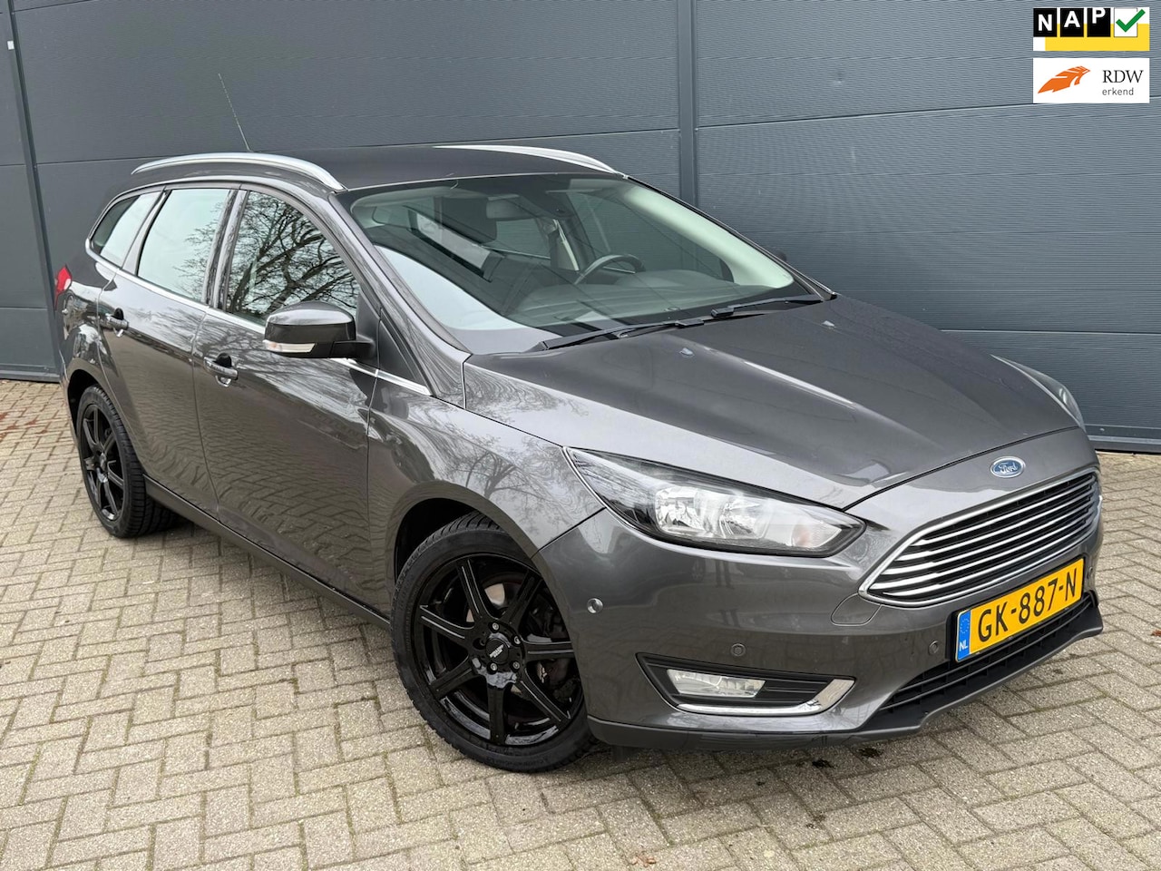 Ford Focus Wagon - 1.0 Titanium/Navi/Airco/cruise/bluetooth/parkeersensoren - AutoWereld.nl