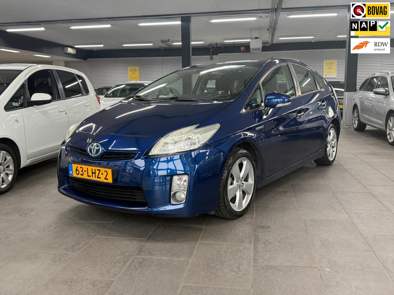 Toyota Prius - 1.8 Aspiration 1-eigenaar clima cruise control lm-velgen elektr-pakket parkeersensoren tre - AutoWereld.nl