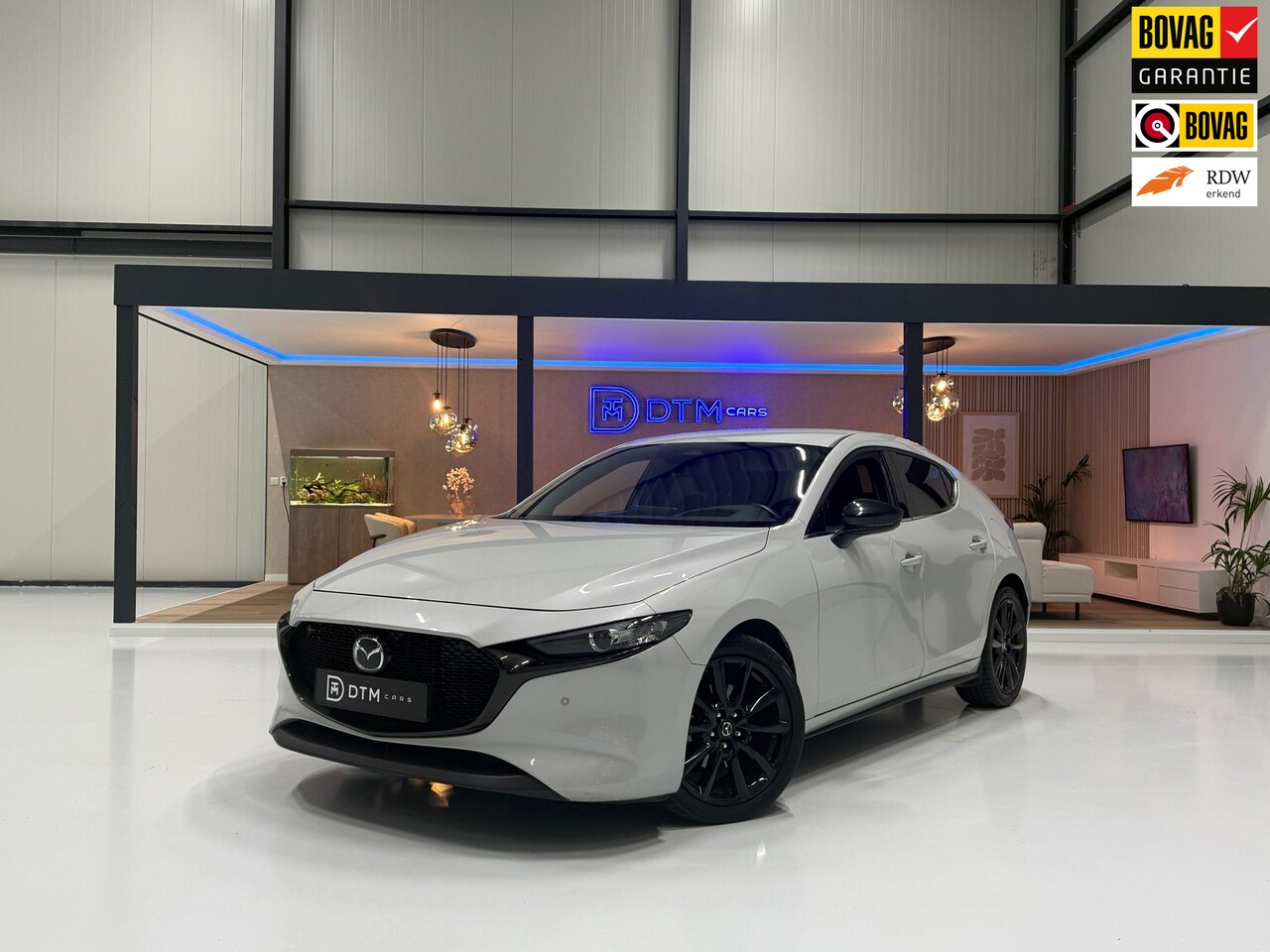 Mazda 3 - 2.0 e-Hybrid Aut 150 Homura Navi Hud Camera PDC Led Adapt Cruise Clima Keyless CarPlay - AutoWereld.nl