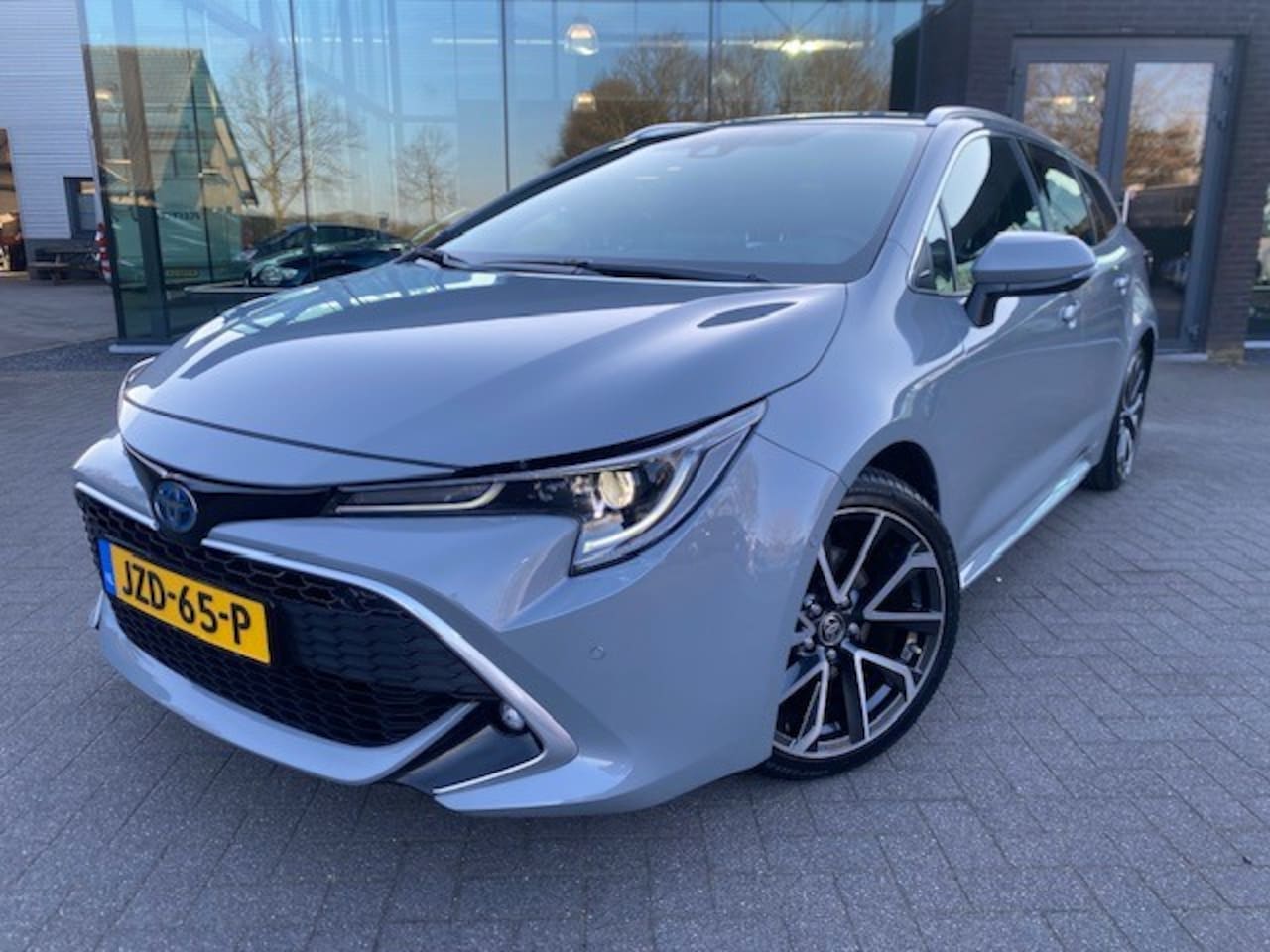 Toyota Corolla Touring Sports - 2.0 Hybrid Premium sport stoelen - AutoWereld.nl
