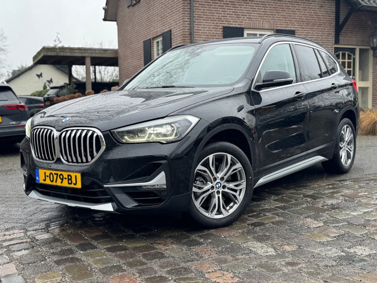 BMW X1 - sDrive 2.0i 192pk autom ecc,beigeleer,lmv,navi,led,chroom,dglas,camera - AutoWereld.nl