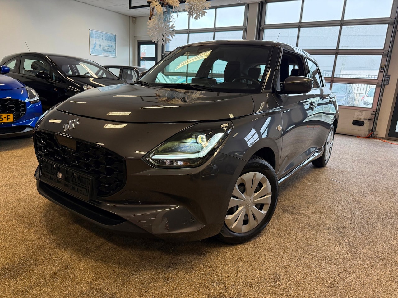 Suzuki Swift - 1.2 Comfort Smart Hybrid | Navi |Carplay | 10 jaar garantie - AutoWereld.nl