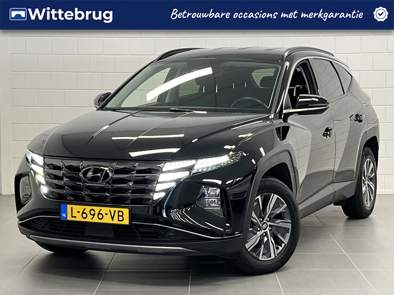 Hyundai Tucson - 1.6 T-GDI HEV Comfort NAVIGATIE | STOELVERWARMING | ZUINIGE HYBRIDE | DEALER ONDERHOUDEN! - AutoWereld.nl
