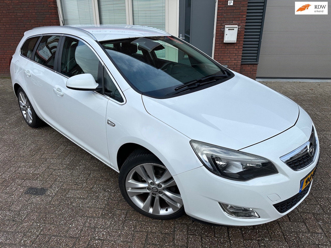 Opel Astra Sports Tourer - 1.4 Turbo Sport / Clima / Cruise / LM / NAP - AutoWereld.nl