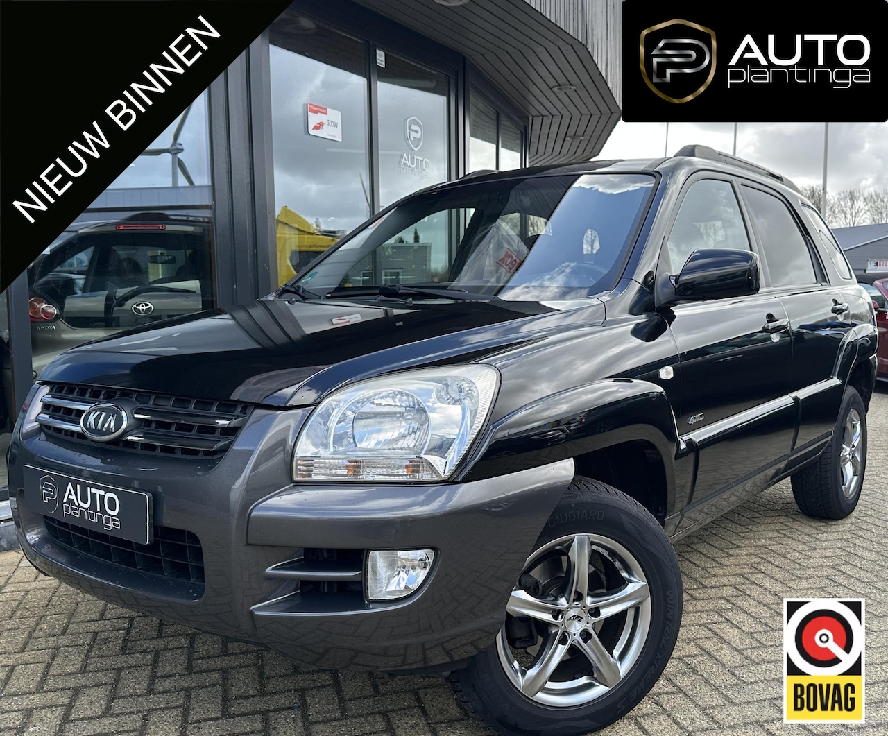 Kia Sportage - 2.0 CVVT Comfort 141PK | Dealeronderhouden | Zeer Nette Staat | NL AUTO | 2 Sleutels | Cli - AutoWereld.nl