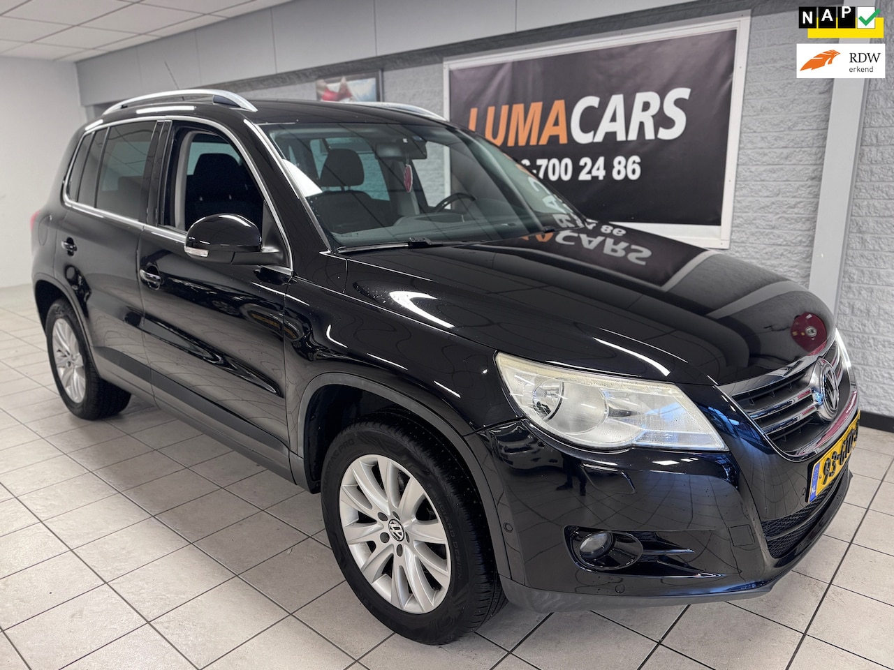 Volkswagen Tiguan - 2.0 TSI Sport&Style |4Motion|Carplay|Airco|Automaat|Trekhaak - AutoWereld.nl