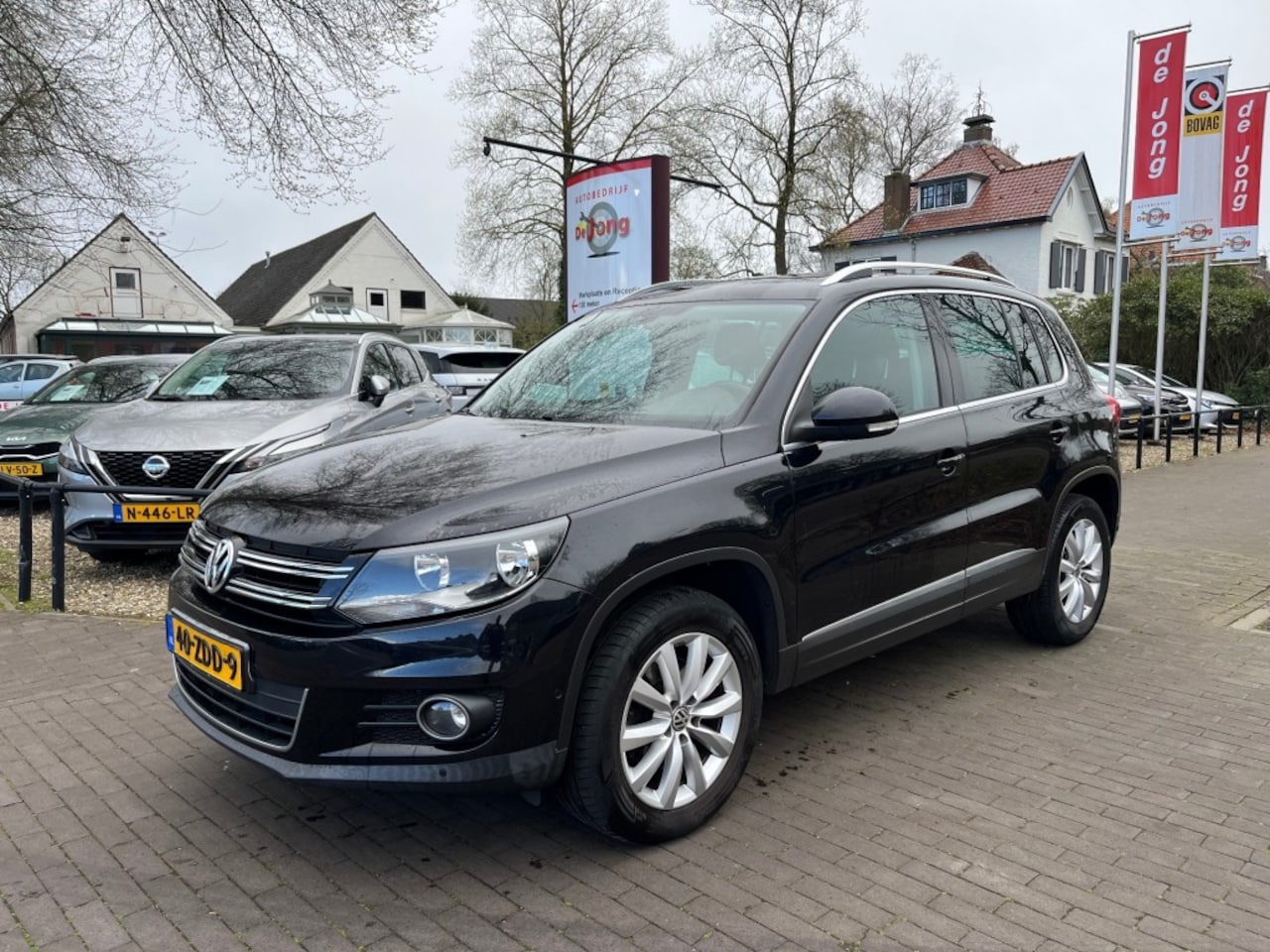 Volkswagen Tiguan - 1.4 TSI SPORTenSTYLE / SCHUIFDAK / NAVI / CRUISE CTR. / TREKHAAK / 17'' LM-VELGEN - AutoWereld.nl