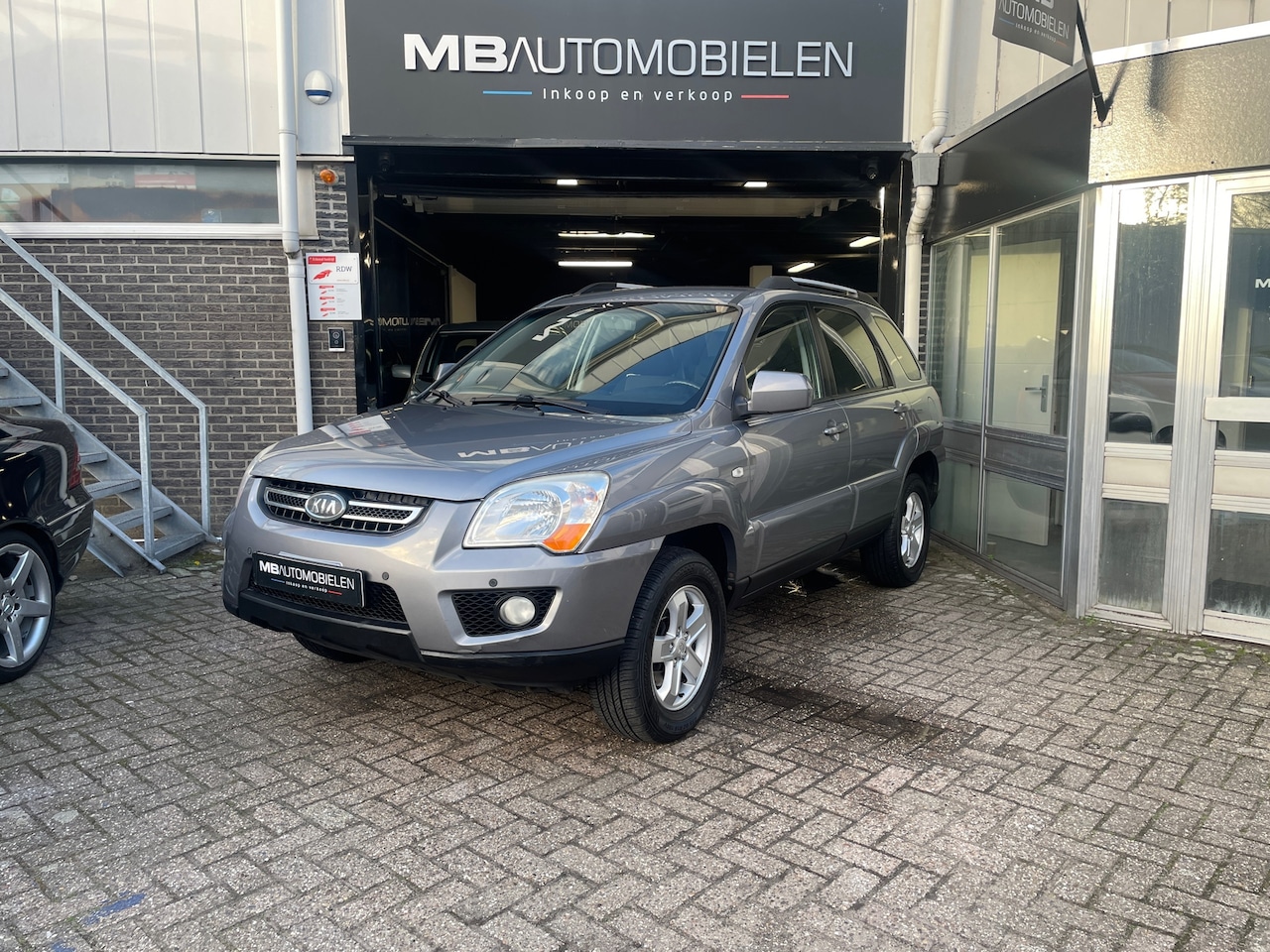 Kia Sportage - 2.0 CVVT X-ecutive/Airco/full Options/Nap/Lm Velgen/1 Jaar APK! - AutoWereld.nl